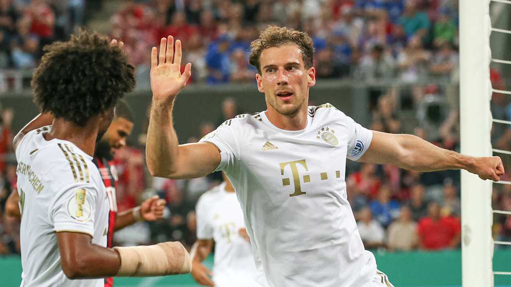 FC Bayern's Leon Goretzka celebrates with teammate Serge Gnabry.