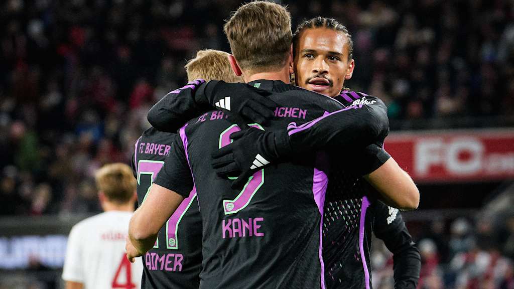 Harry Kane and Leroy Sane celebrate Bayern's goal away at Köln.