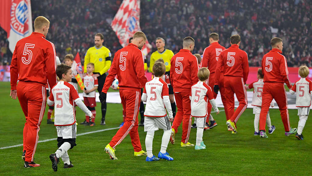 Bayern and Hoffenheim players walk onto the pitch