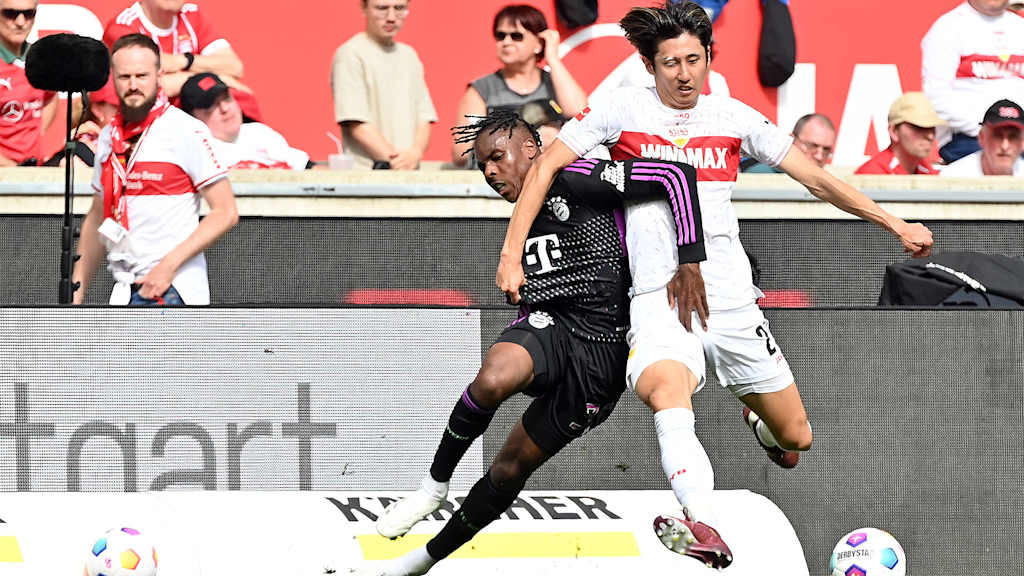 Hiroki Ito tussles with Mathys Tel in the Bundesliga match VfB Stuttgart vs. FC Bayern
