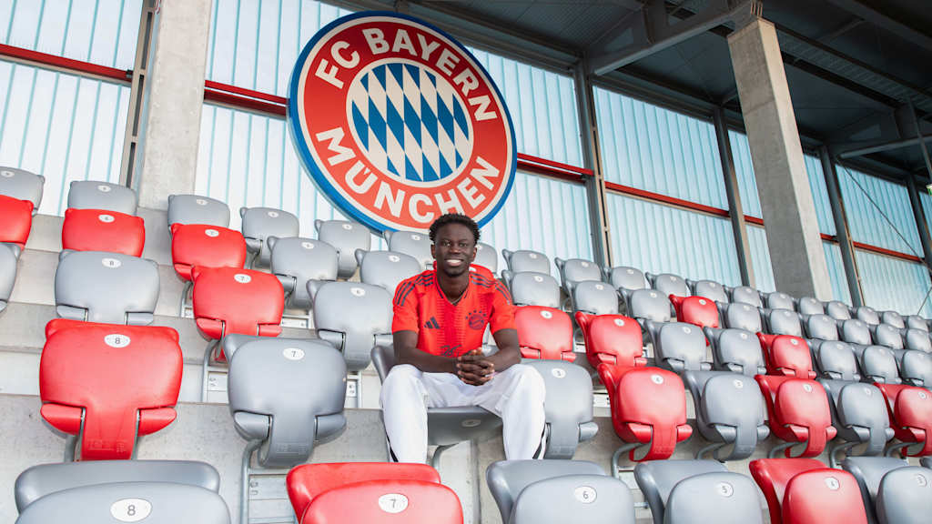Bajung Darboe sitting in the stands of the FC Bayern Campus stadium