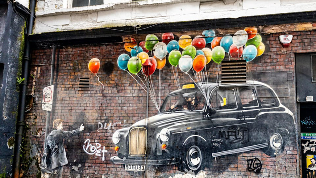 Graffiti car on a brick wall