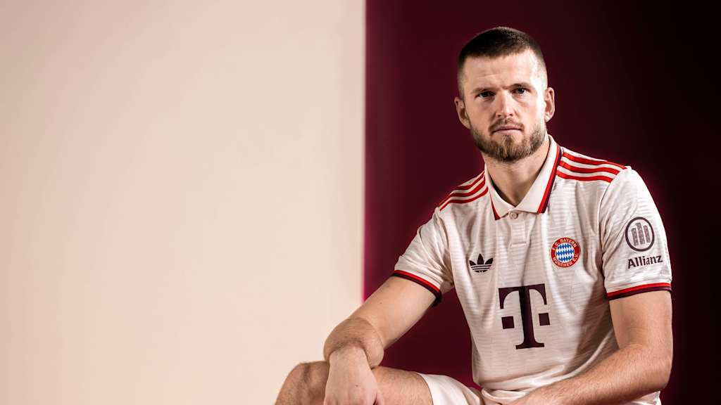 Eric Dier schaut im weißen Trikot in die Kamera