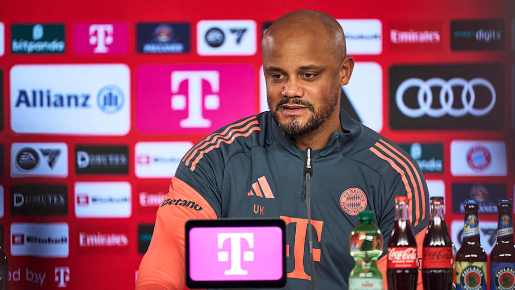 Vincent Kompany smiles confidently during FC Bayern training