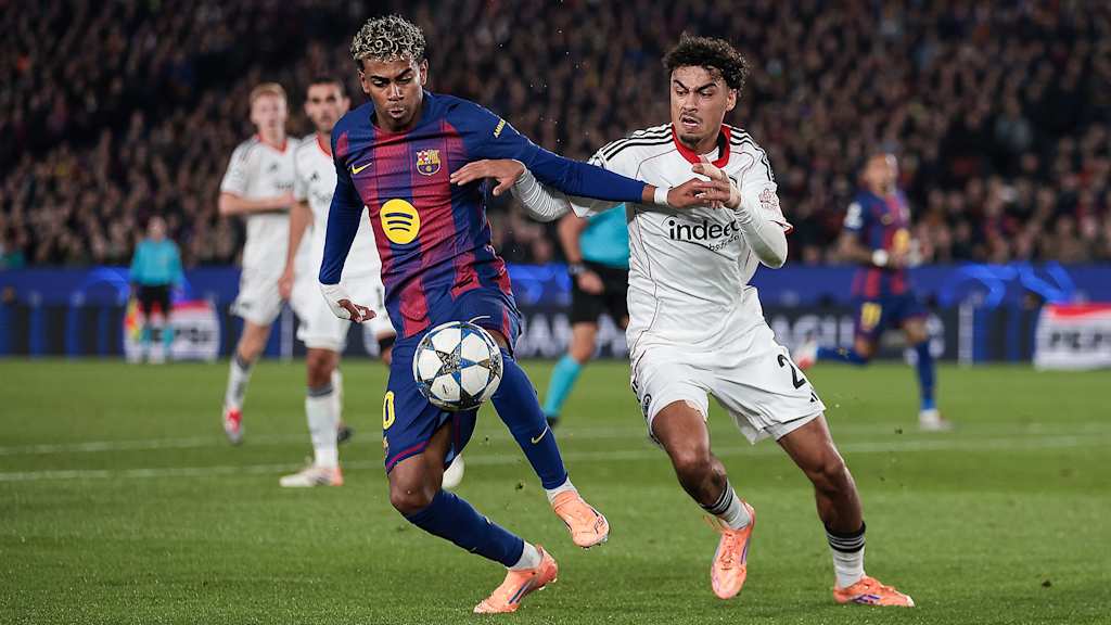 Nathaniel Brown (Eintracht Frankfurt) in a tussle with Barcelona’s Lamine Yamal during a Champions League game
