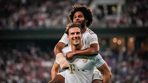 Leon Goretzka celebrates with Serge Gnabry