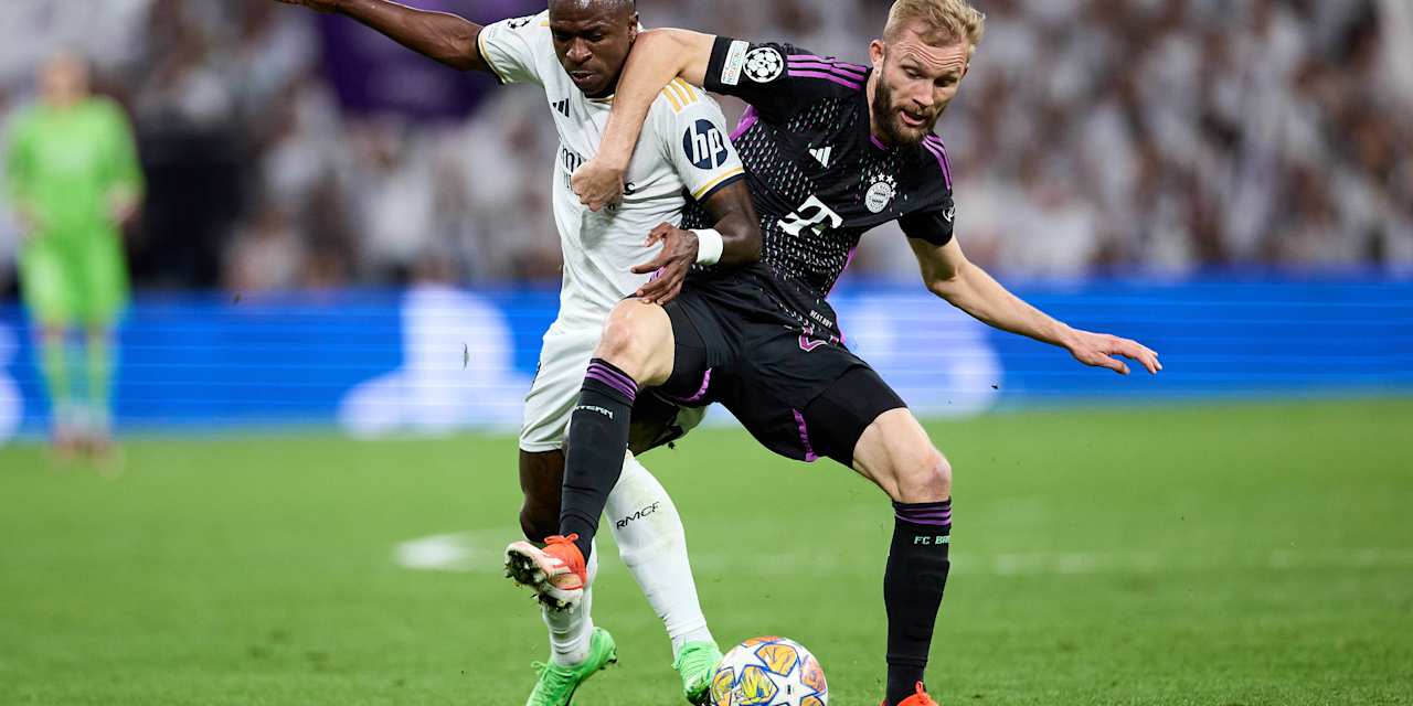 Vinicius Junior von Real Madrid und Konrad Laimer vom FC Bayern im Zweikampf.