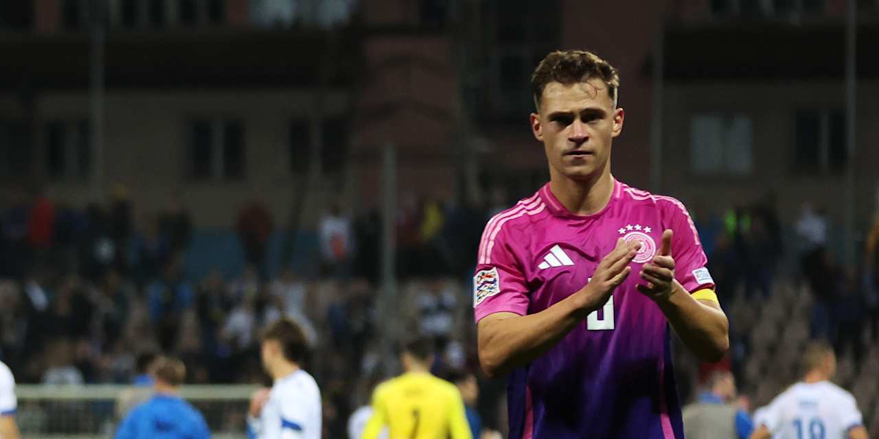 Joshua Kimmich applauds after Germany's win in Bosnia and Herzegovina