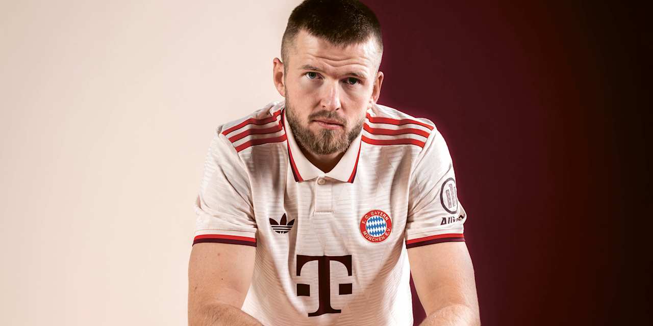 Eric Dier schaut im weißen Trikot in die Kamera