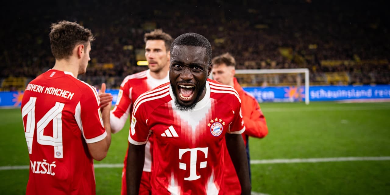 Dayot Upamecano celebra en Dortmund, sonriendo a la cámara.