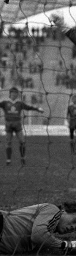 Dieter Hoeneß (FC Bayern München) scores the goal against goalkeeper Carsten Hallmann (1. FC Saarbrücken) to make it 2:1, Michael Rummenigge (FC Bayern München) celebrates