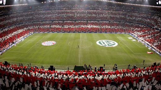 Allianz Arena packed with Bayern Munich fans creating a red-and-white tifo before a match