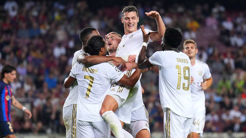 Smells like team spirit: Bayern celebrate victory in Barcelona.