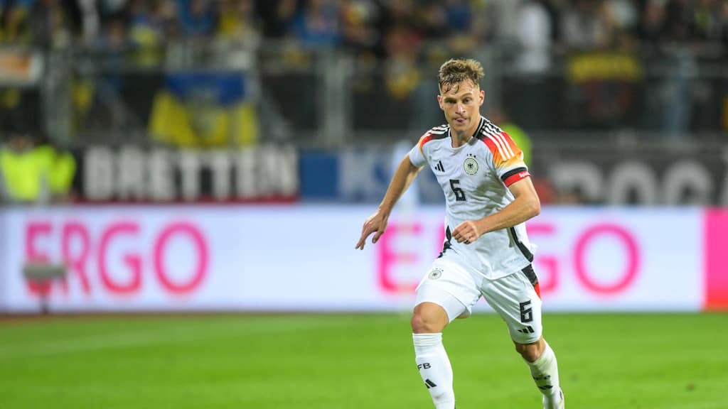 Joshua Kimmich on the ball, wearing the Germany jersey and the captain's armband.