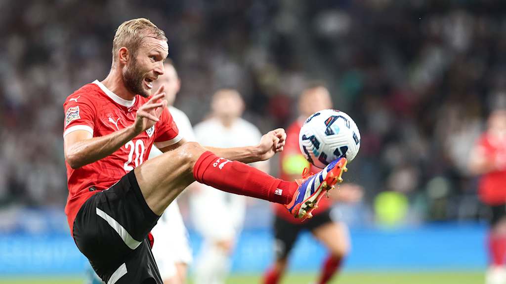 Konrad Laimer brings the ball down.