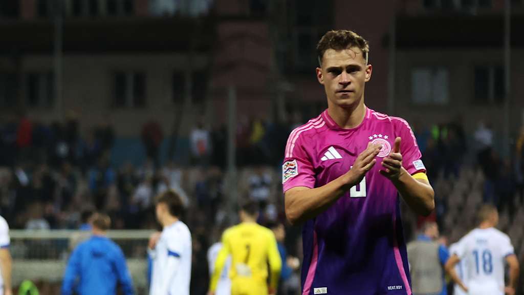 Joshua Kimmich applauds after Germany's win in Bosnia and Herzegovina