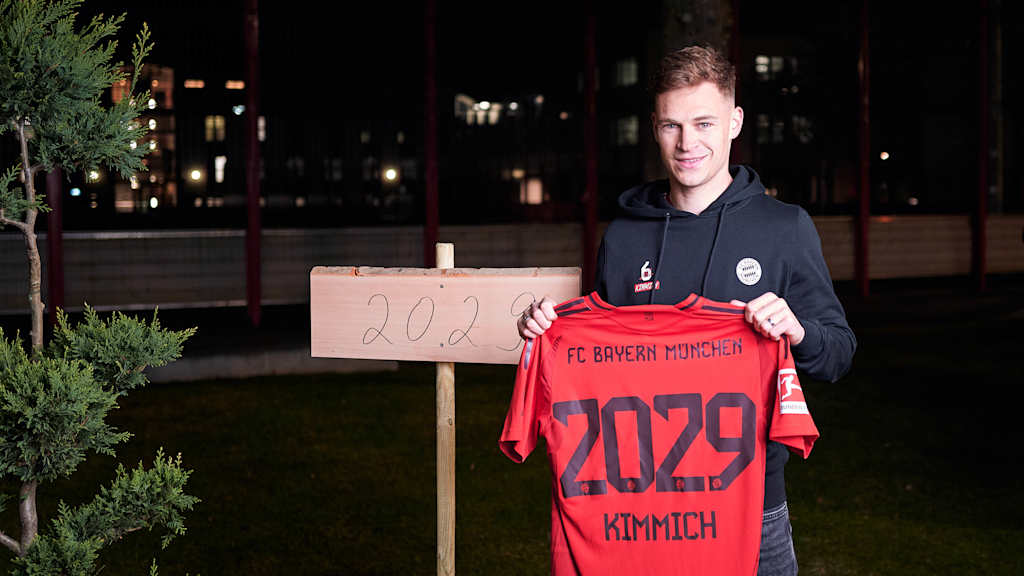 Joshua Kimmich holding up a shirt with 2029