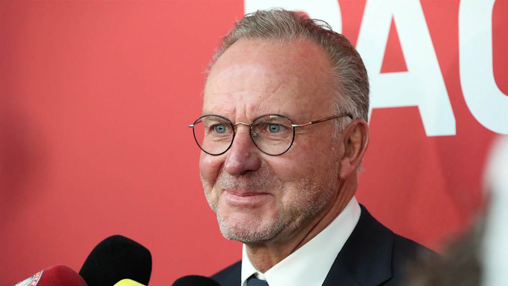 Portrait of Karl Heinz-Rummenigge smiling during an interview with representatives of the media.