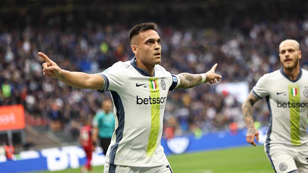 Lautaro Martinez celebrates in Inter Milan's white jersey