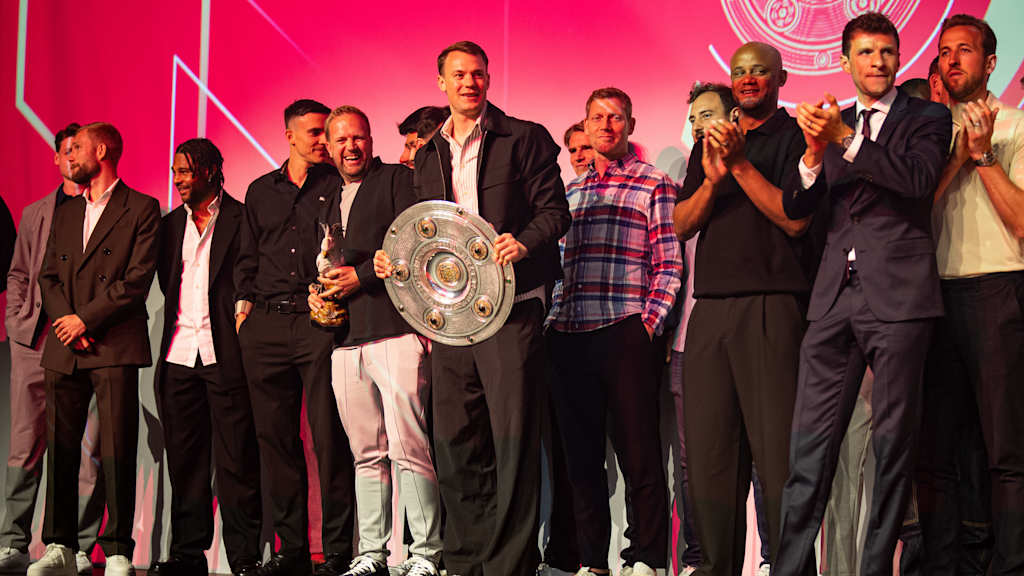 The FC Bayern men's team celebrate with their trophies