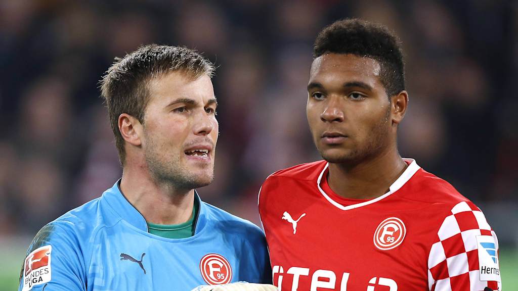 Jonathan Tah with Michael Rensing.