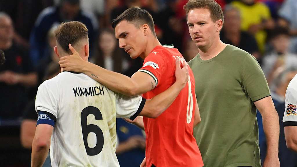 Joao Palhinha (Portugal) consoles Joshua Kimmich (Germany) after an international.