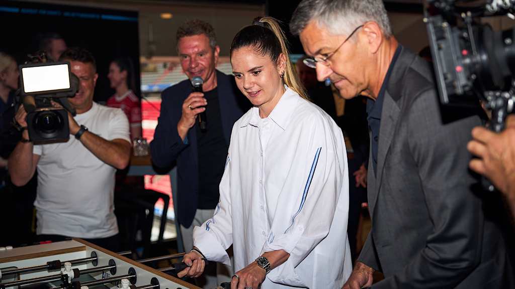 Sarah Zadrazil and Herbert Hainer played table football at the event for the campaign “Not all heroes wear jersey” at the Allianz Arena.