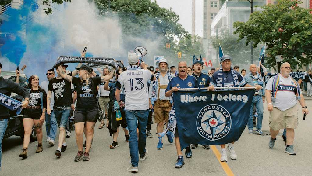 Vancouver Whitecaps fans march to the stadium