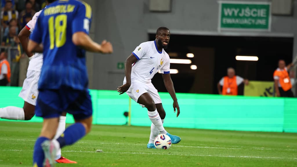 Dayot Upamecano dribbles with the ball in the international between France and Ukraine.