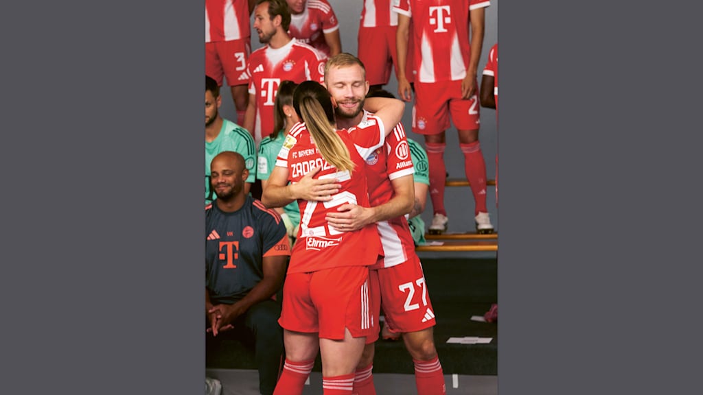 Konrad Laimer hugs Sarah Zadrazil at the photo shoot