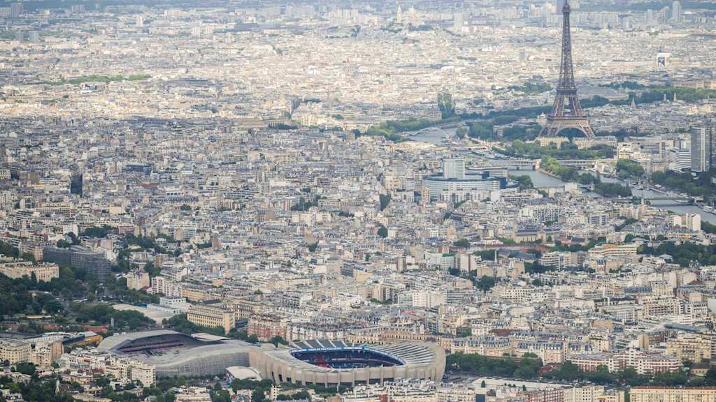 A bird's-eye view of the PSG stadium and the Eiffel Tower.