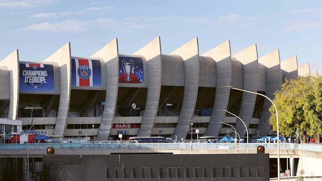 The Parc des Princes from the outside with posters celebrating the 2025 Champions League victory.
