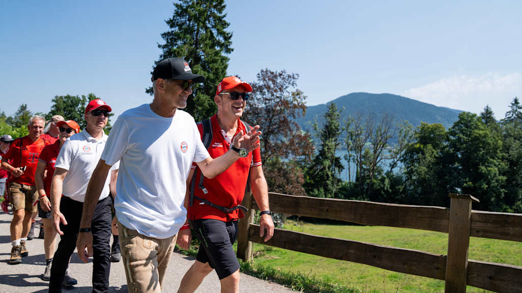 President Herbert Hainer walking with fans around Tegernsee