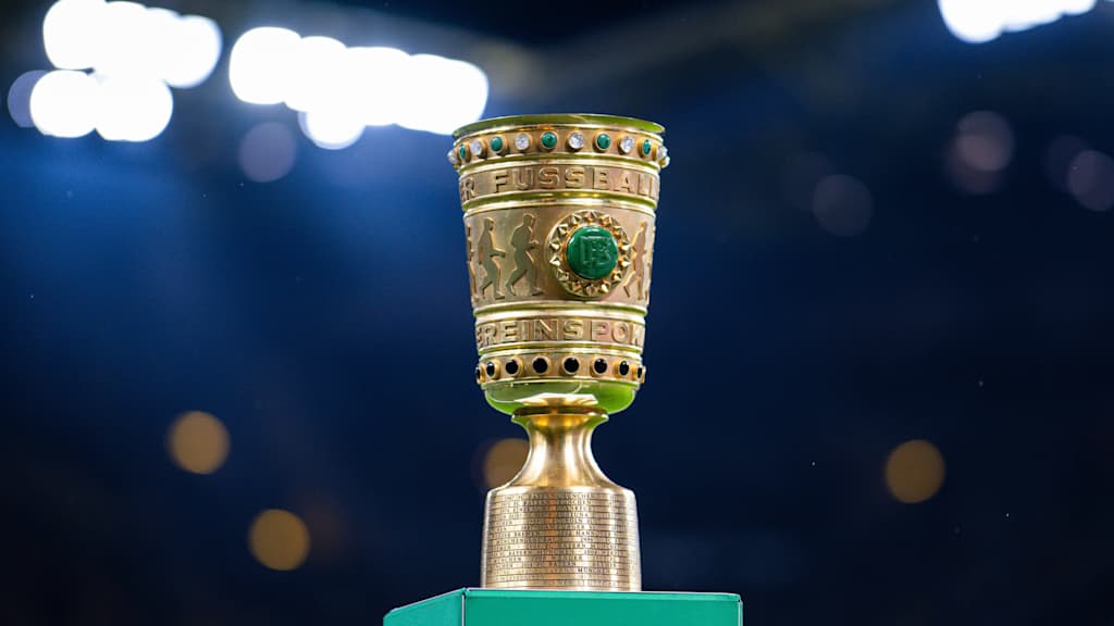 The DFB Cup trophy standing on a plinth in the stadium