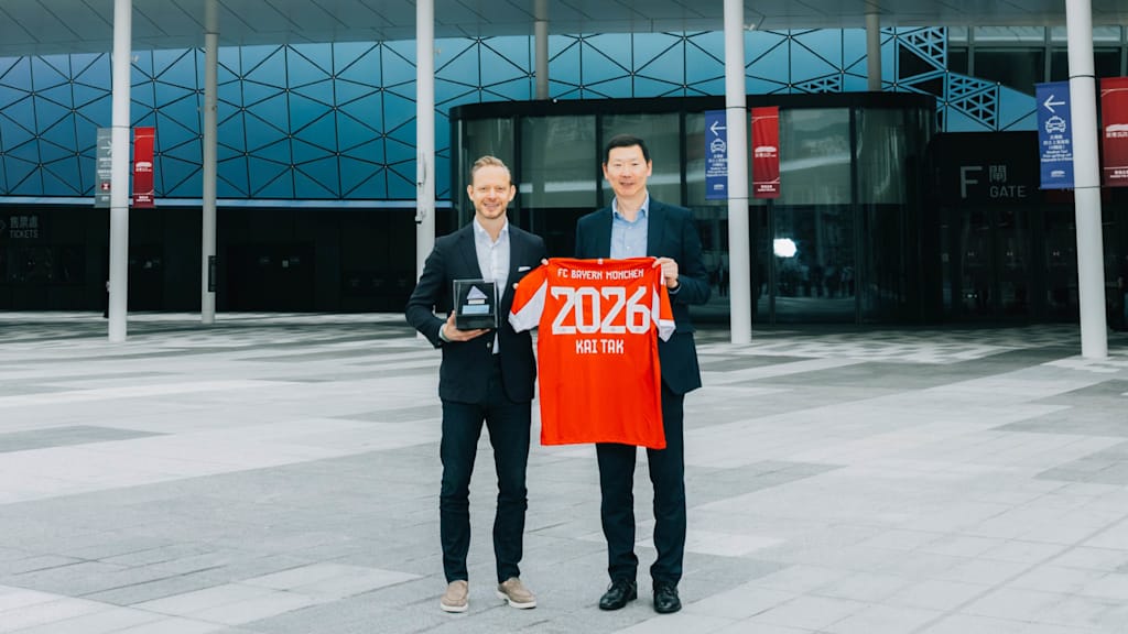 Rouven Kasper outside Kai Tak Stadium in Hong Kong with Terruce Wang, Chief Commercial Officer of Kai Tak Sports Park.