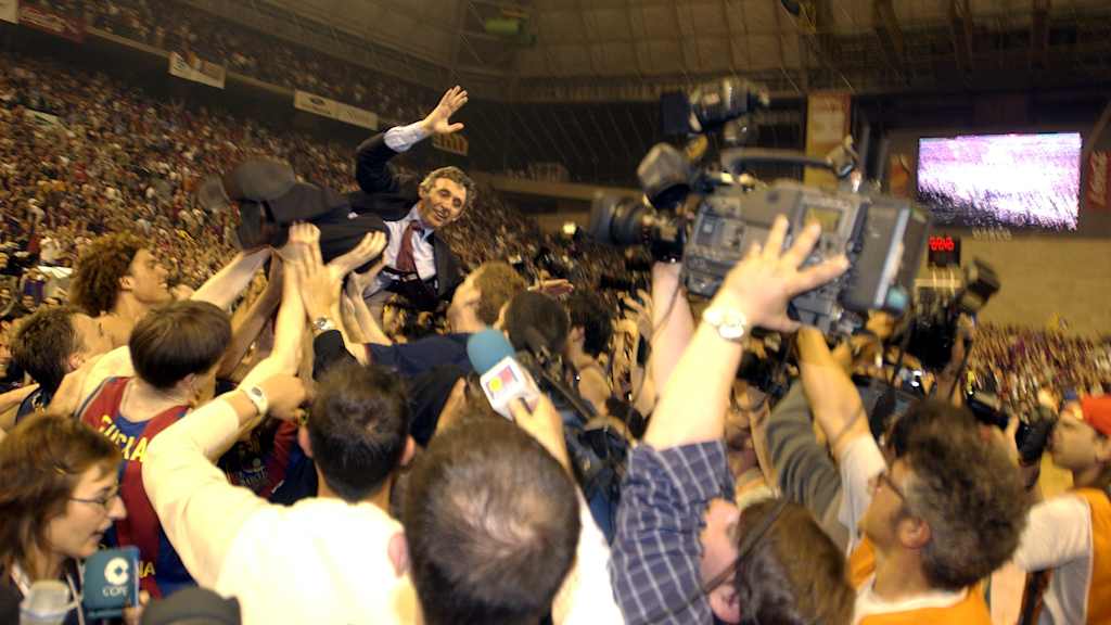 Barcelona’s players hoist coach Svetislav Pesic into the air in celebration