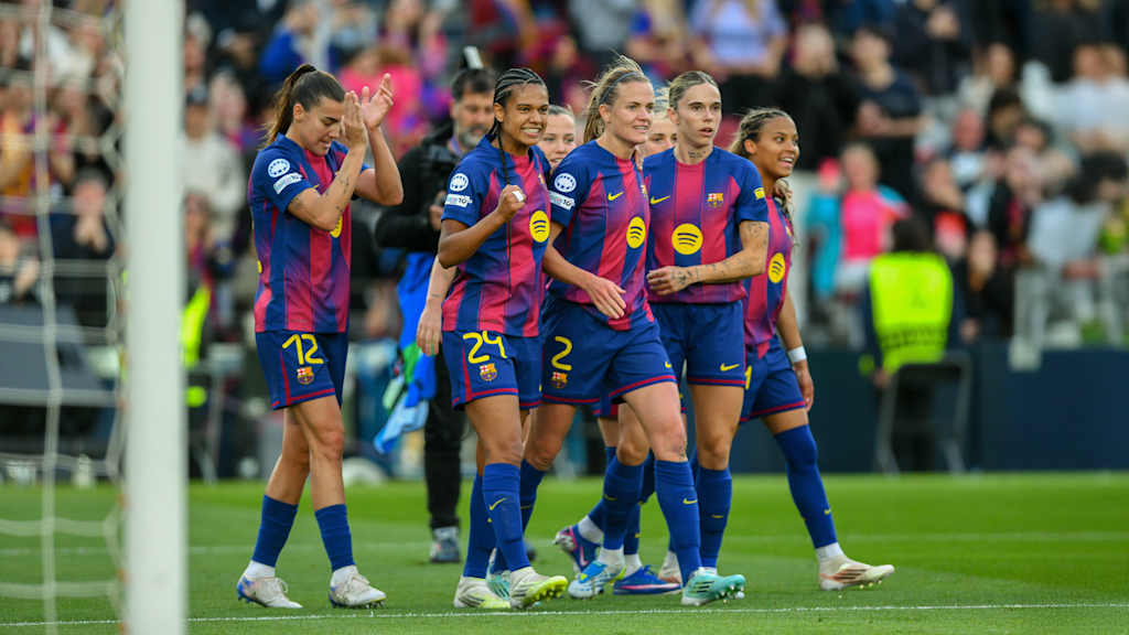The Barcelona players celebrate after scoring a goal against Real Madrid.