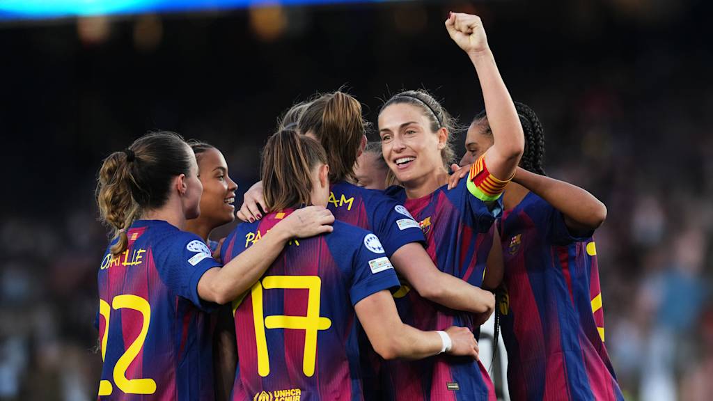 The Barcelona players celebrate after scoring a goal against Real Madrid.