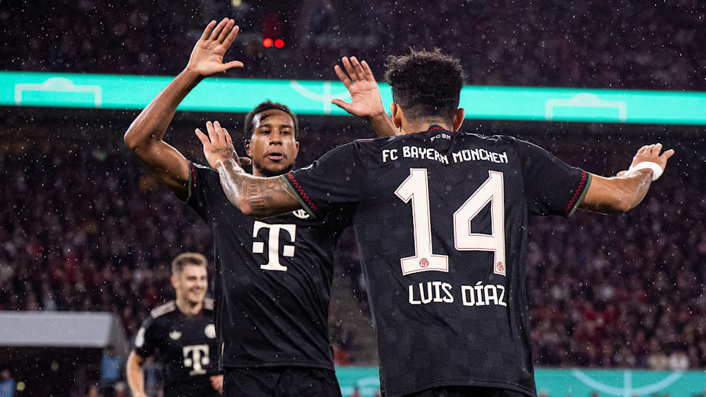 Michael Olise and Luis Díaz celebrate a goal in FC Bayern's DFB Cup tie at 1 FC Köln.
