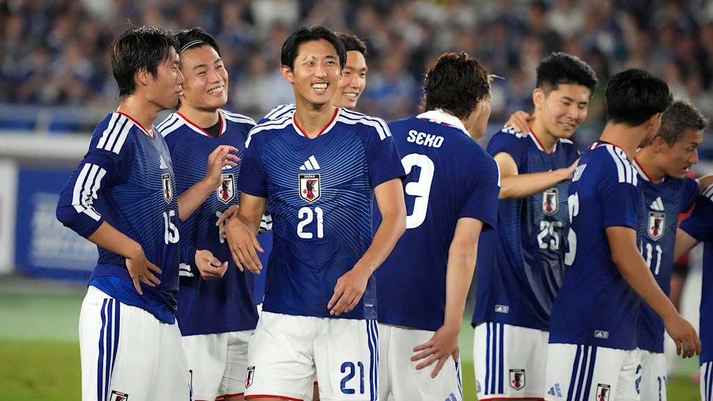 Hiroki Ito laughs with his Japanese team-mates following the international win against Ecuador.