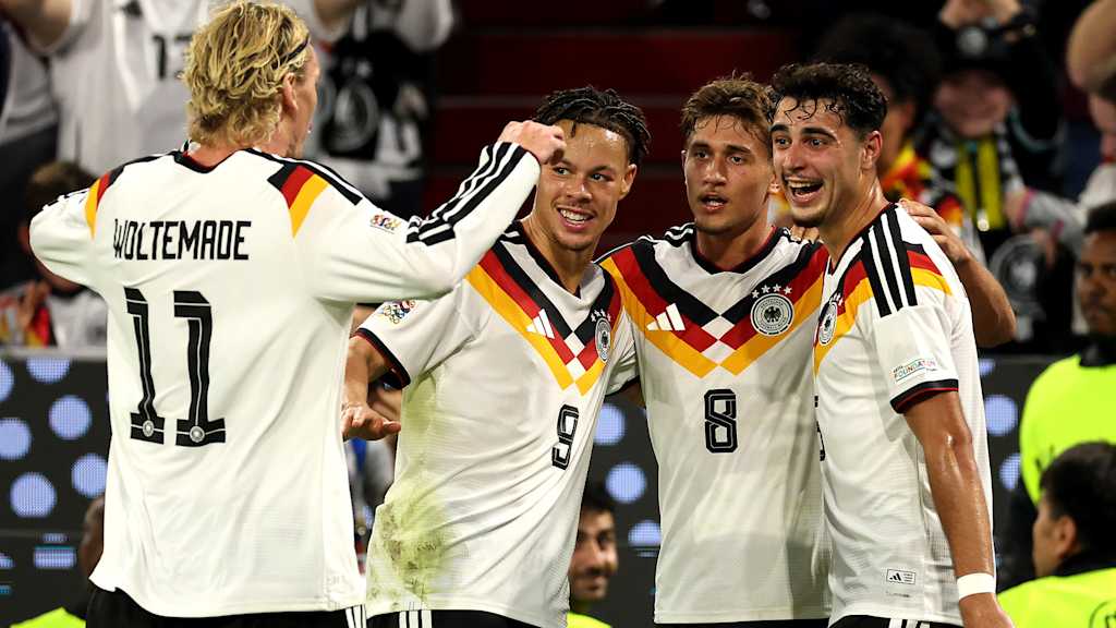 Derry Sherhant, Tom Bischof and Aleksandar Pavlovic after a Germany goal at the Allianz Arena
