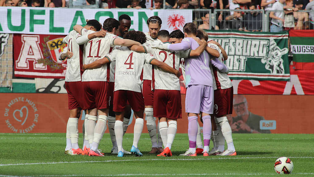 FC Augsburg players in a huddle