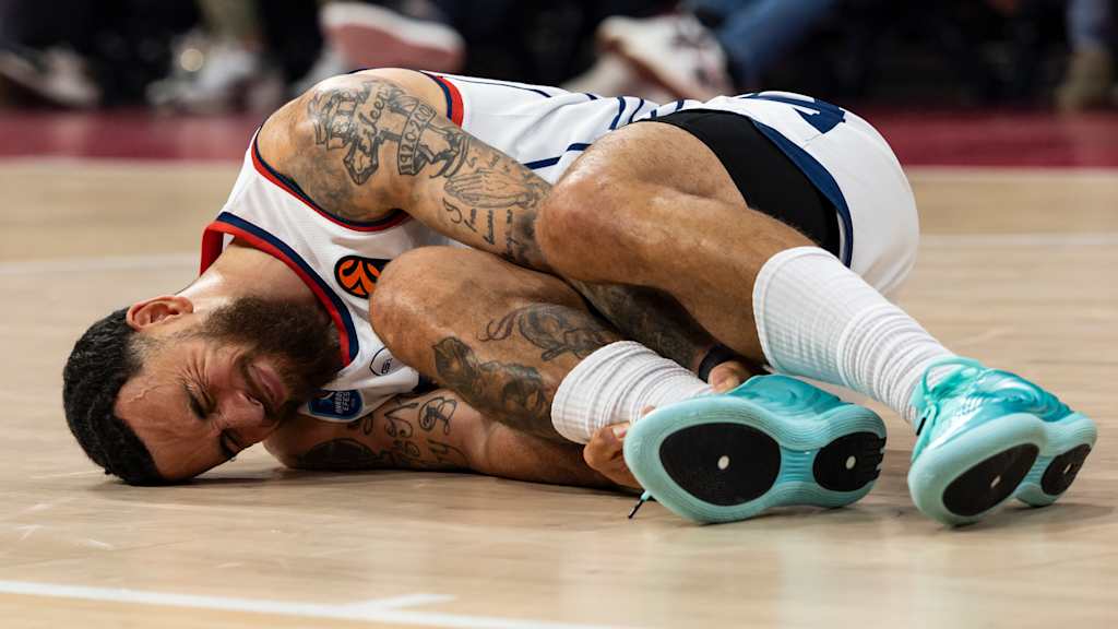 Mike James lies on the court after suffering an injury