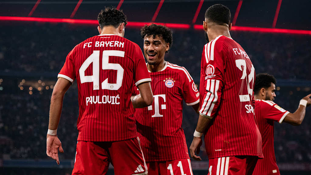 Nathaniel Brown congratulates Aleks Pavlovic after the 1–0 win in the top match in the Bundesliga between FC Bayern and RB Leipzig.