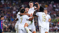 Smells like team spirit: Bayern celebrate victory in Barcelona.