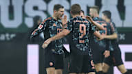 Leon Goretzka und Harry Kane bejubeln ein Tor gegen Gladbach