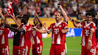 Harry Kane and other players celebrate with the fans after the win over Boca Juniors