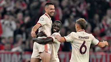 Raphael Guerreiro celebrates his goal against Zagreb with Dayot Upamecano
