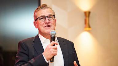 Jan-Christian Dreesen gives a speech at the FC Bayern banquet in Rotterdam.