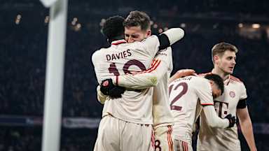 Goalscorer Alphonso Davies and Leon Goretzka embrace